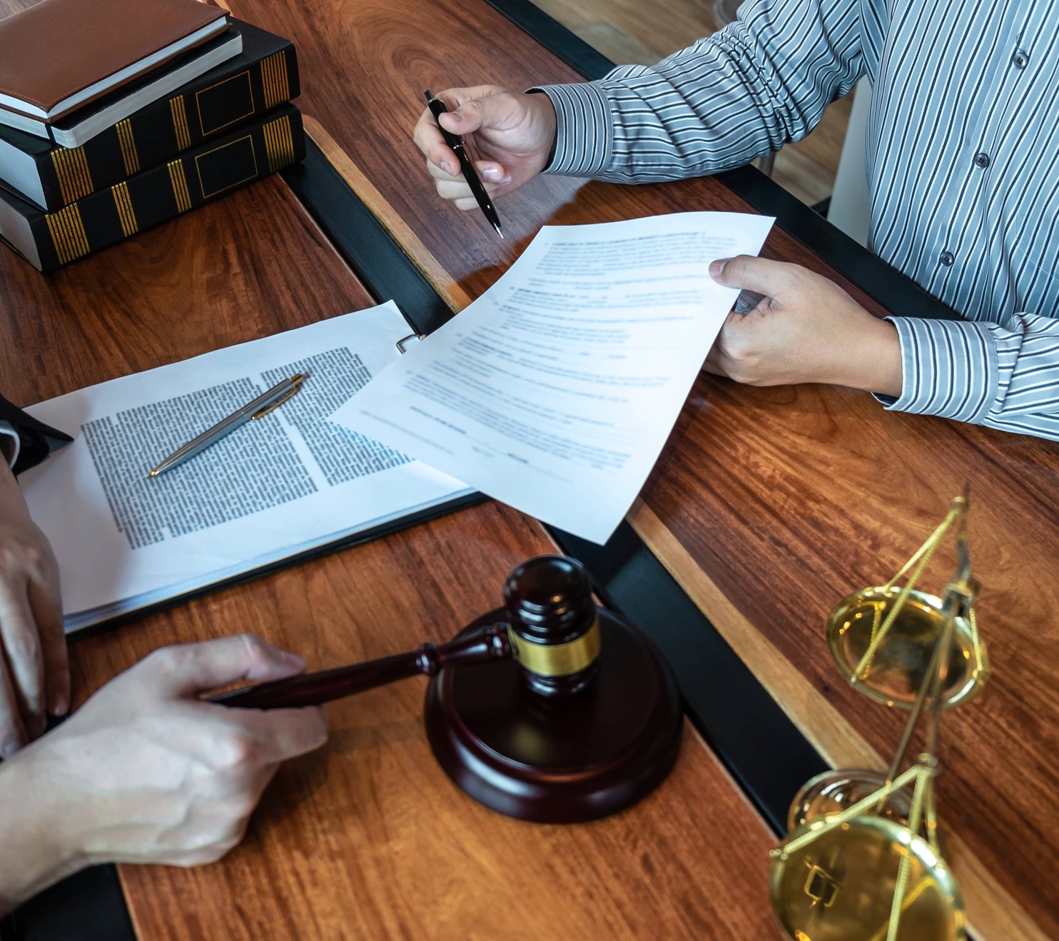 Business consultation with attorney reviewing documents